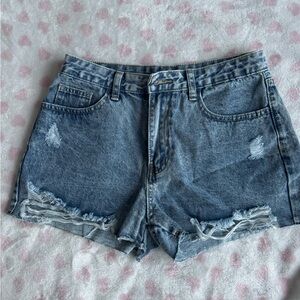 High-waisted distressed denim dark blue wash shorty shorts